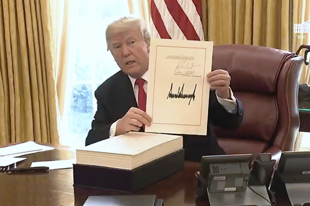 President Signs Historic Tax Cuts And Jobs Act; Stocks Drop A Fraction